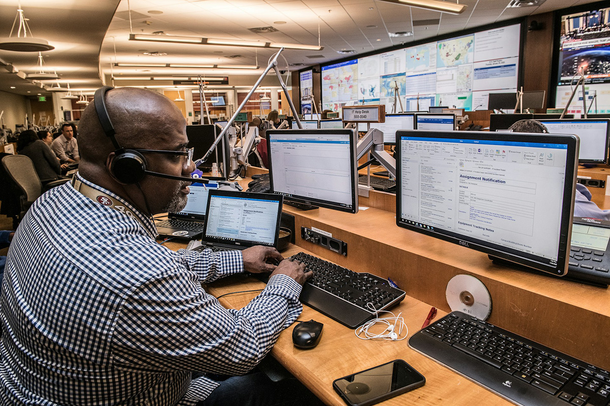 Support technician with a headset working through a ticket queue