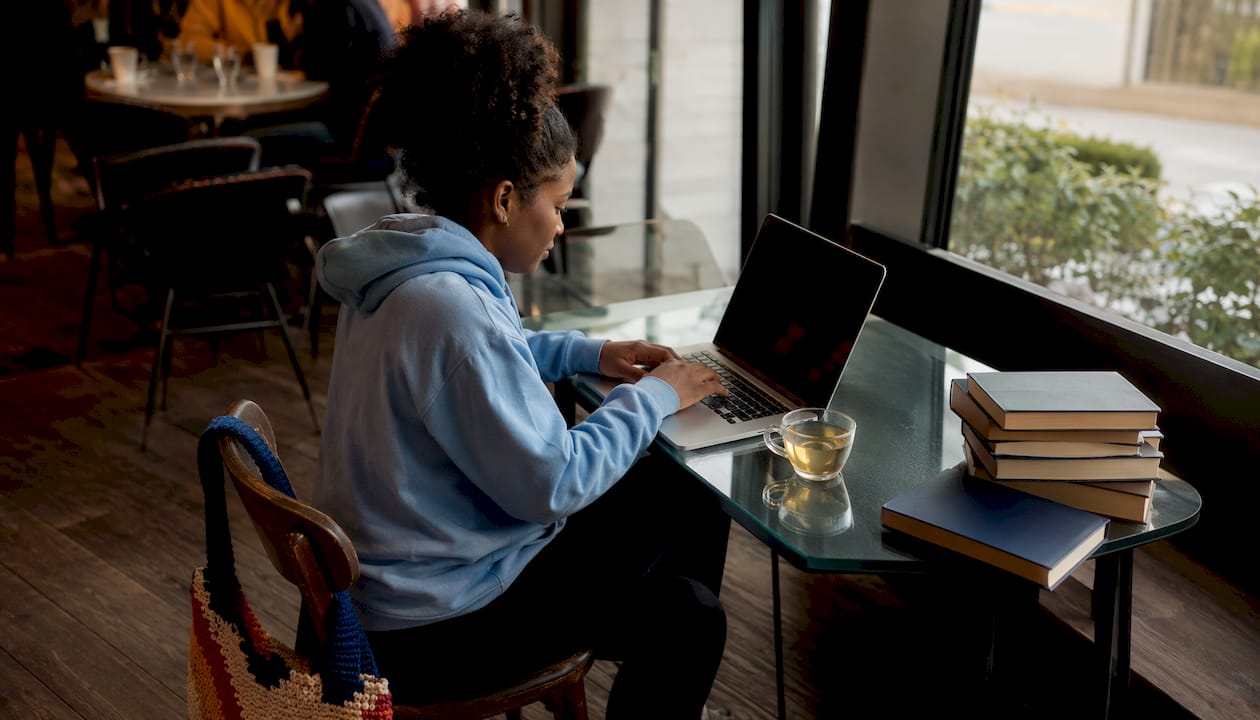 Woman working on cybersecurity lab at home