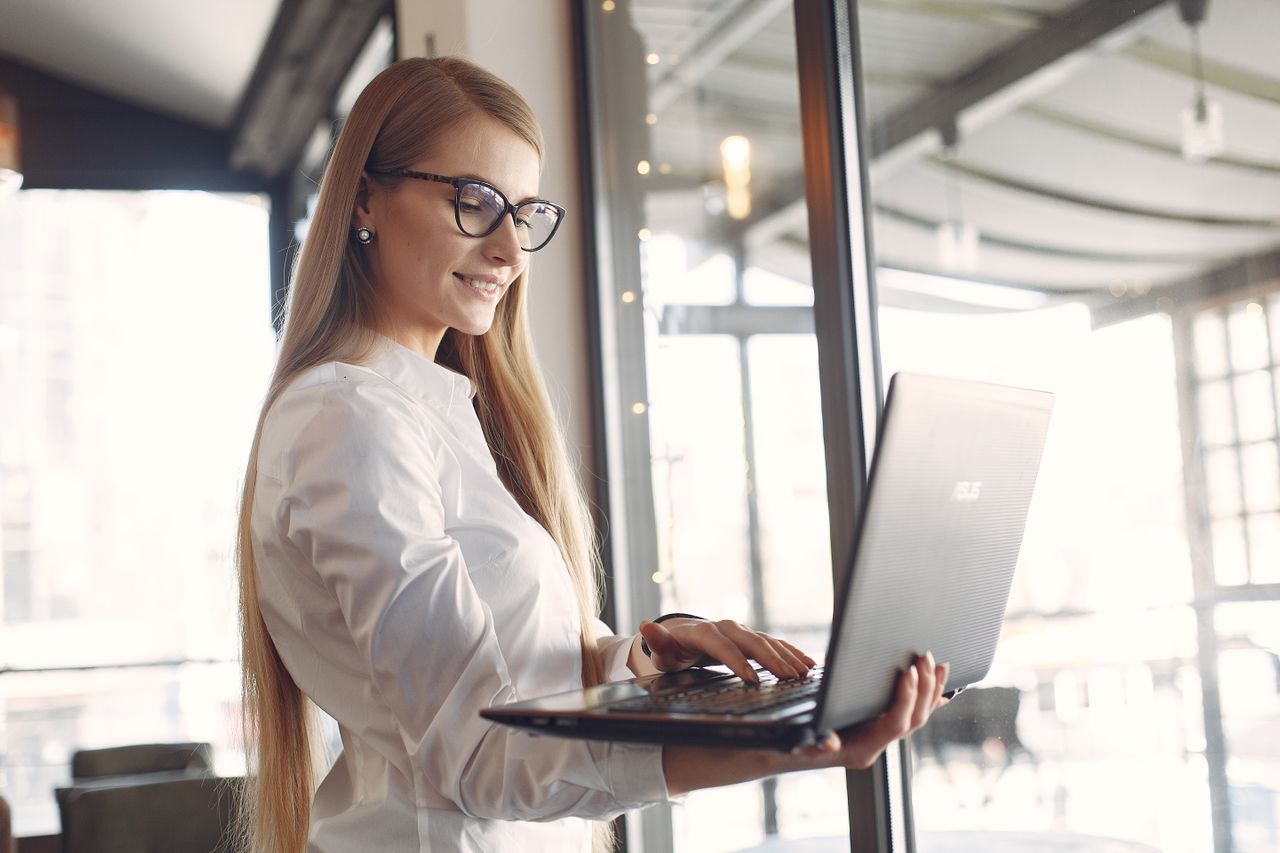 A woman working in cybersecurity at her computer