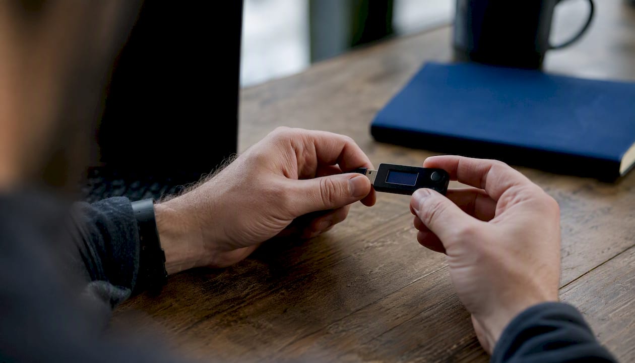 Hands holding encryption hardware token