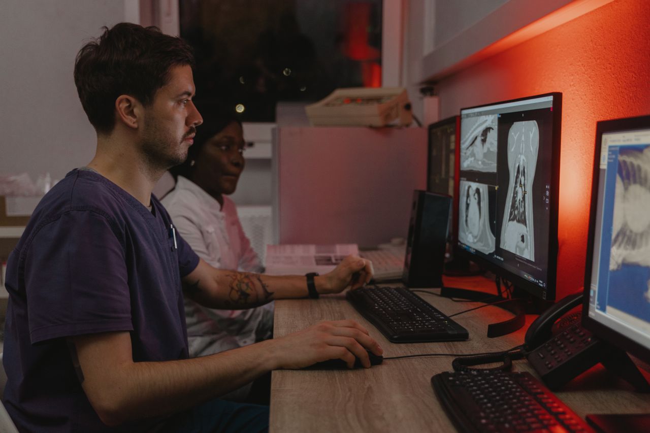 medical doctor at computer